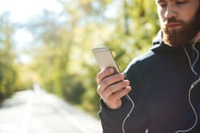 graphicstock-athletic-runner-with-phone-in-park-cropped-image_H87eVC_XOnl.jpg